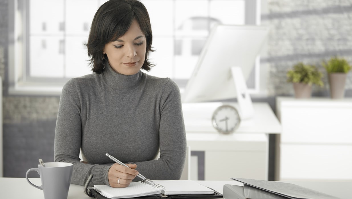Business woman working on start-up checklist
