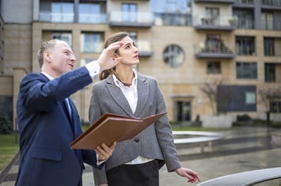 Commercial real estate agent advising a client